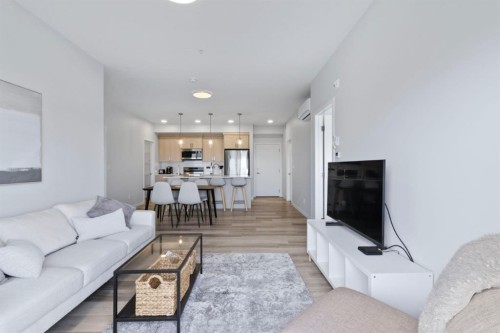 1411-220 Seton Grove Se, Calgary, AB - Indoor Photo Showing Living Room