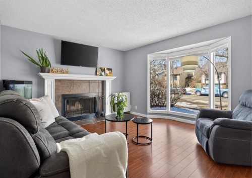 8005 Ranchview Drive Nw, Calgary, AB - Indoor Photo Showing Living Room With Fireplace
