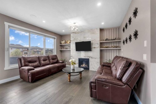 7 Waterford Heights, Chestermere, AB - Indoor Photo Showing Living Room With Fireplace