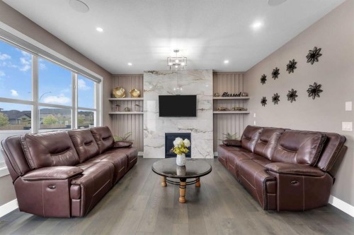 7 Waterford Heights, Chestermere, AB - Indoor Photo Showing Living Room With Fireplace