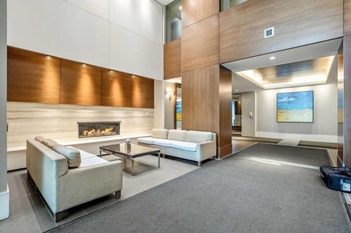 451-222 Riverfront Avenue Sw, Calgary, AB - Indoor Photo Showing Other Room With Fireplace