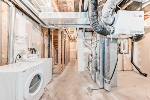 207-620 Luxstone Landing Sw, Airdrie, AB - Indoor Photo Showing Laundry Room