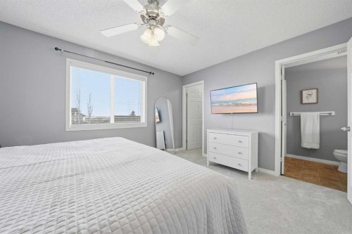 74 Cranberry Close Se, Calgary, AB - Indoor Photo Showing Bedroom
