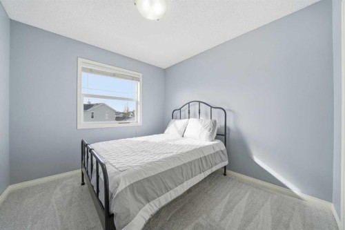74 Cranberry Close Se, Calgary, AB - Indoor Photo Showing Bedroom