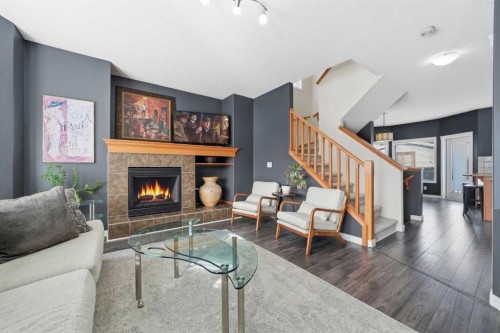 74 Cranberry Close Se, Calgary, AB - Indoor Photo Showing Living Room With Fireplace