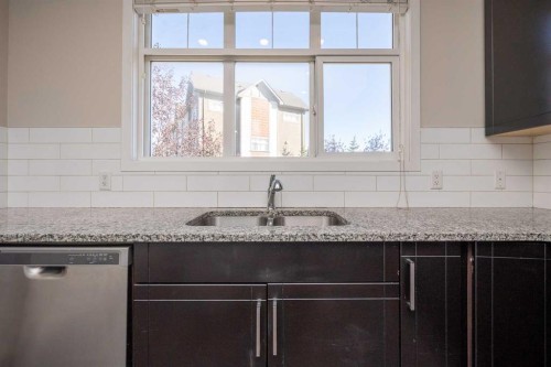 203 Copperstone Park Se, Calgary, AB - Indoor Photo Showing Kitchen With Double Sink