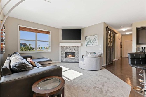 415 Auburn Bay Avenue Se, Calgary, AB - Indoor Photo Showing Living Room With Fireplace