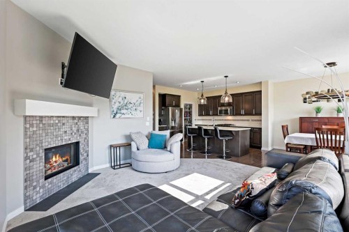 415 Auburn Bay Avenue Se, Calgary, AB - Indoor Photo Showing Living Room With Fireplace