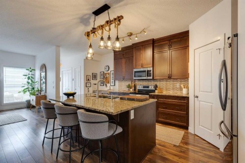 112 Fireside Drive, Cochrane, AB - Indoor Photo Showing Kitchen With Double Sink