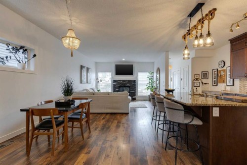 112 Fireside Drive, Cochrane, AB - Indoor Photo Showing Other Room With Fireplace