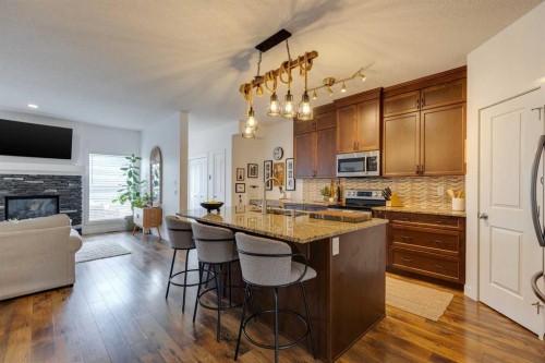 112 Fireside Drive, Cochrane, AB - Indoor With Fireplace