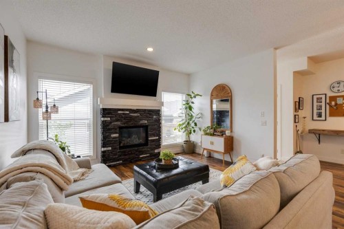 112 Fireside Drive, Cochrane, AB - Indoor Photo Showing Living Room With Fireplace
