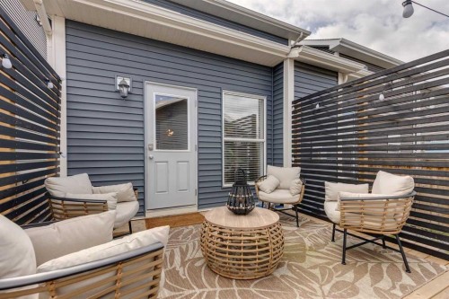 112 Fireside Drive, Cochrane, AB - Outdoor With Deck Patio Veranda With Exterior