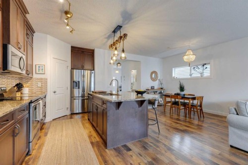 112 Fireside Drive, Cochrane, AB - Indoor Photo Showing Kitchen With Upgraded Kitchen