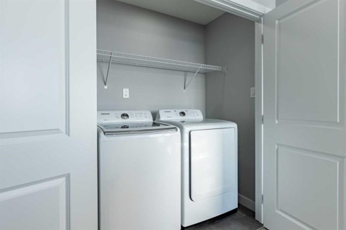 7 Heritage Point, Cochrane, AB - Indoor Photo Showing Laundry Room