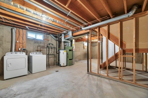 56 Cedarwood Hill Sw, Calgary, AB - Indoor Photo Showing Laundry Room