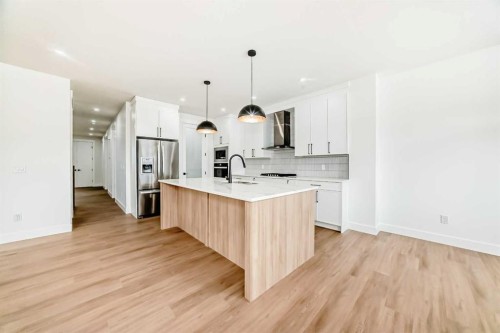 28 Saddlecrest Manor Ne, Calgary, AB - Indoor Photo Showing Kitchen With Upgraded Kitchen