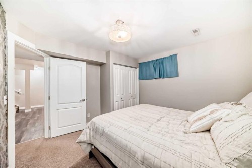 449 Sunset Link, Crossfield, AB - Indoor Photo Showing Bedroom