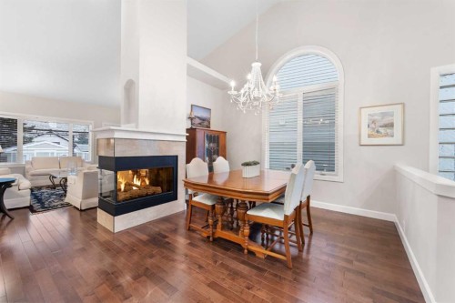 71 Chaparral Close Se, Calgary, AB - Indoor Photo Showing Dining Room With Fireplace