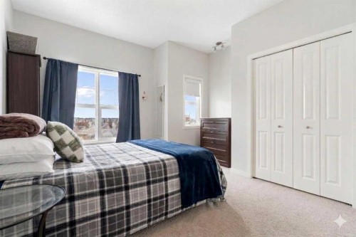 408-250 Fireside View, Cochrane, AB - Indoor Photo Showing Bedroom