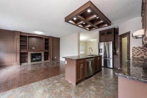 422 Taralake Way Ne, Calgary, AB - Indoor Photo Showing Kitchen With Fireplace
