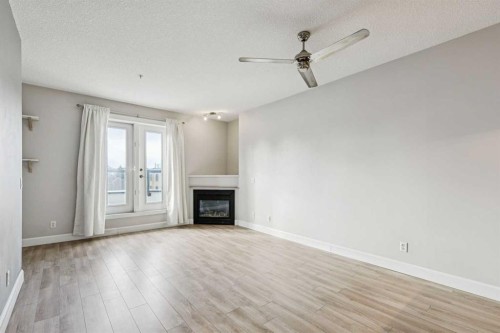 403-830 Centre Avenue Ne, Calgary, AB - Indoor Photo Showing Living Room With Fireplace