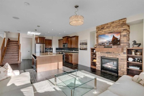 287 Sunset View, Cochrane, AB - Indoor Photo Showing Living Room With Fireplace