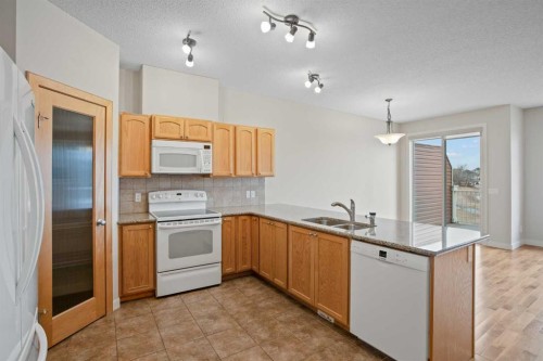 36-351 Monteith Drive Se, High River, AB - Indoor Photo Showing Kitchen With Double Sink