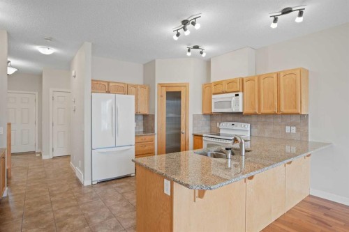36-351 Monteith Drive Se, High River, AB - Indoor Photo Showing Kitchen With Double Sink