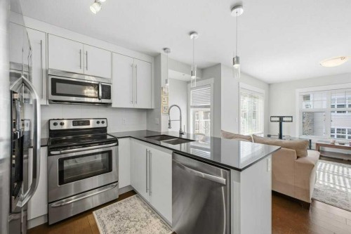 2413-11 Mahogany Row Se, Calgary, AB - Indoor Photo Showing Kitchen With Double Sink With Upgraded Kitchen