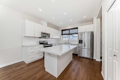 80 Magnolia Way Se, Calgary, AB - Indoor Photo Showing Kitchen With Stainless Steel Kitchen With Upgraded Kitchen