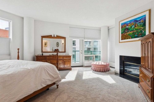 901-837 2 Avenue Sw, Calgary, AB - Indoor Photo Showing Bedroom With Fireplace