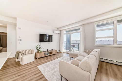 2307-55 Lucas Way Nw, Calgary, AB - Indoor Photo Showing Living Room