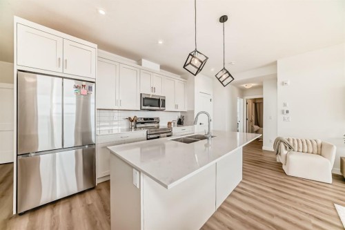 2307-55 Lucas Way Nw, Calgary, AB - Indoor Photo Showing Kitchen With Stainless Steel Kitchen With Double Sink With Upgraded Kitchen