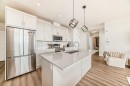 2307-55 Lucas Way Nw, Calgary, AB  - Indoor Photo Showing Kitchen With Stainless Steel Kitchen With Double Sink With Upgraded Kitchen 