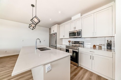 2307-55 Lucas Way Nw, Calgary, AB - Indoor Photo Showing Kitchen With Double Sink With Upgraded Kitchen