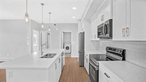 1302-220 Seton Grove Se, Calgary, AB - Indoor Photo Showing Kitchen With Double Sink With Upgraded Kitchen