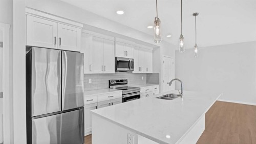 1302-220 Seton Grove Se, Calgary, AB - Indoor Photo Showing Kitchen With Double Sink With Upgraded Kitchen