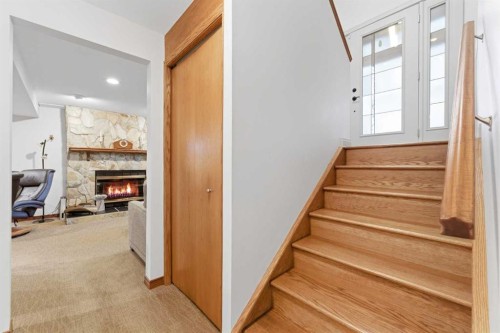 228 Cantrell Place Sw, Calgary, AB - Indoor Photo Showing Other Room With Fireplace