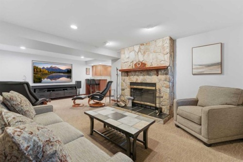 228 Cantrell Place Sw, Calgary, AB - Indoor Photo Showing Living Room With Fireplace