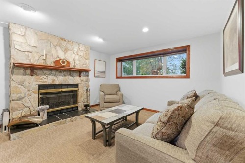 228 Cantrell Place Sw, Calgary, AB - Indoor Photo Showing Living Room With Fireplace