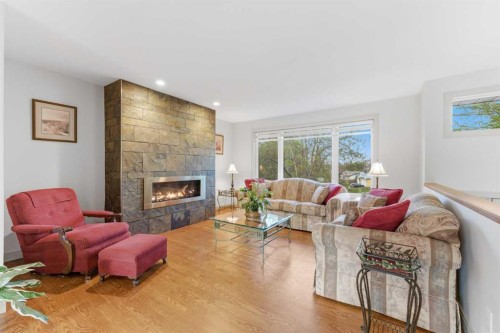 228 Cantrell Place Sw, Calgary, AB - Indoor Photo Showing Living Room With Fireplace