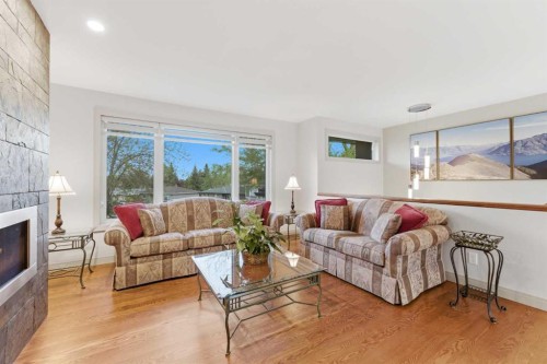 228 Cantrell Place Sw, Calgary, AB - Indoor Photo Showing Living Room With Fireplace