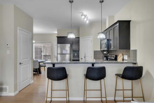 1002-1001 8 Street Nw, Airdrie, AB - Indoor Photo Showing Kitchen With Upgraded Kitchen