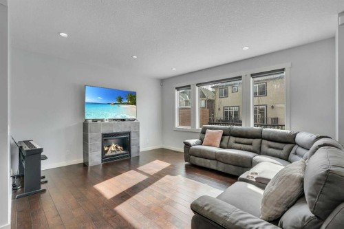 151 Stonemere Green, Chestermere, AB - Indoor Photo Showing Living Room With Fireplace