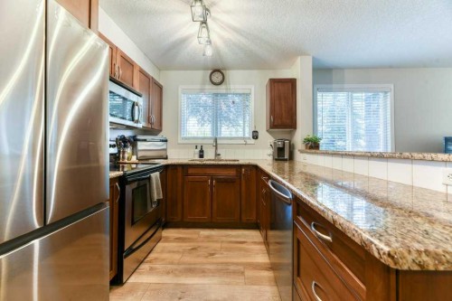 102-6315 Ranchview Drive Nw, Calgary, AB - Indoor Photo Showing Kitchen With Stainless Steel Kitchen