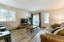 102-6315 Ranchview Drive Nw, Calgary, AB  - Indoor Photo Showing Living Room 