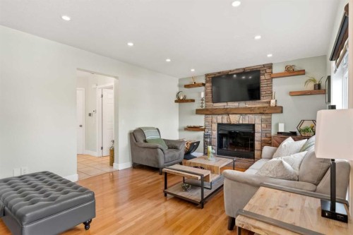 49 Macewan Ridge Close Nw, Calgary, AB - Indoor Photo Showing Living Room With Fireplace