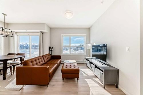 209-4250 Seton Drive Se, Calgary, AB - Indoor Photo Showing Living Room