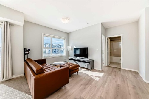 209-4250 Seton Drive Se, Calgary, AB - Indoor Photo Showing Living Room